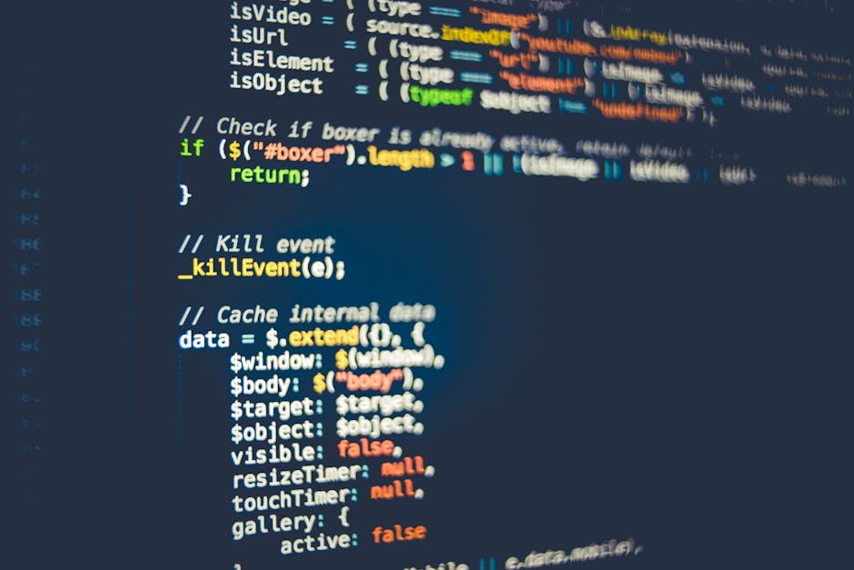 A close-up view of a laptop computer displaying a code editor with multiple lines of programming code, including variables, functions, and comments, on a dark-themed interface. The screen shows a mixt